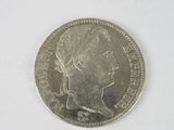an image of a silver coin with a woman ' s face on it