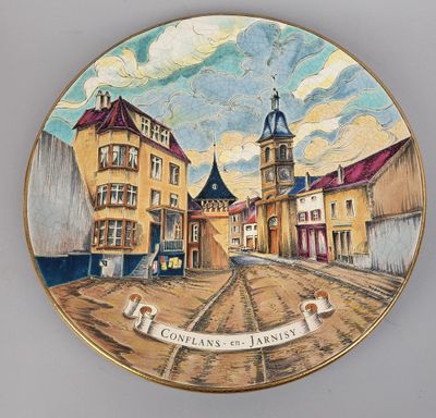 an image of a plate with a picture of a town on it