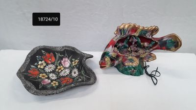 two decorative items that are sitting on a table