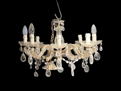 a close up of a chandelier hanging from a ceiling