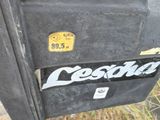 a close up of a parking meter with a sticker on it