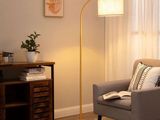 an image of a living room with a chair and a lamp