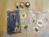 some harry potter figurines on a table next to a bag of harry potter coins
