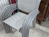 a stack of chairs sitting next to each other in a room