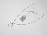 a heart shaped necklace with a price tag attached to it