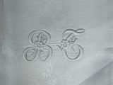 a white table cloth with a picture of two bicycles on it
