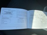 a picture of a book that is open on a car seat