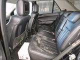 the back seats of a car are covered in black leather