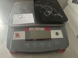 a picture of a kitchen scale with a tablet on it