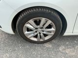 a close up of a car ' s tire on the road