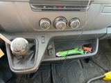 a picture of a car dashboard with a green toothbrush in it