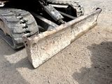 a bulldozer that is sitting in the dirt