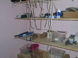 a room that has a bunch of shelves and boxes on it