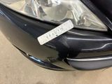 a picture of a car with a sticker on the front of it ' s headlight
