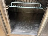 an open door to a stainless steel oven with shelves