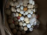 a bag full of golf balls sitting on a window sill