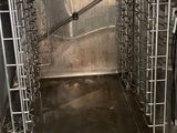 a metal oven that has a door open and a rack in it
