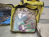 two bags with items in them sitting on a table