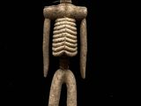 une image représentant une figurine de squelette sur fond noir
