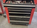 a red workbench with tools on it in a garage