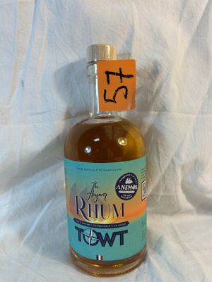 a bottle of rum sitting on a table with a price tag on it