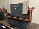 an image of a machine is sitting in a warehouse