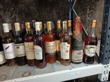 many bottles of wine sitting on a shelf in a wine cellar