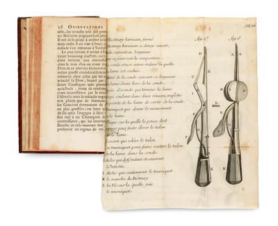 an open book with a drawing of a pair of scissors on top of it