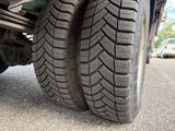 a close up of a truck tire on the road