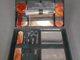 a green case with tools inside of it on a table