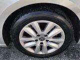a close up of a car ' s tire on the pavement
