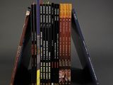 books stacked on top of each other on a gray surface