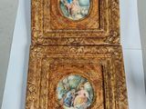 two framed paintings of a woman and a man in a garden
