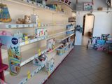 many shelves in the store that have various items on them