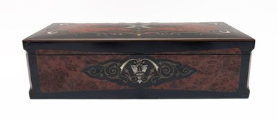 a small wooden box with a decorative design on it