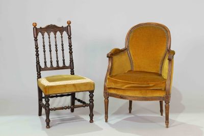pair of antique chairs with yellow upholstered cushions in a white room