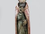 une statue représentant un homme barbu vêtu d'une robe