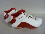 a close up of a pair of white and red shoes