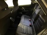 a seat in the back of a car with a remote control