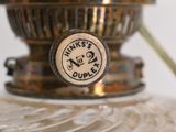 an image of a glass vase with a label on it