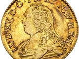 une pièce d'or à l'effigie d'une femme