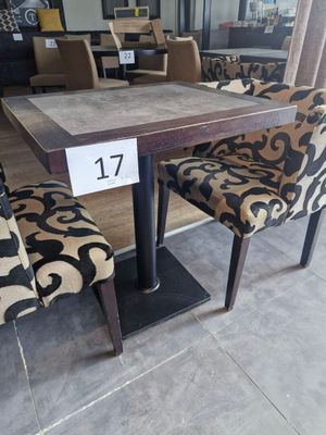a table and chairs in a store with a price tag on it