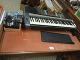 a keyboard and a keyboard on a desk in a room