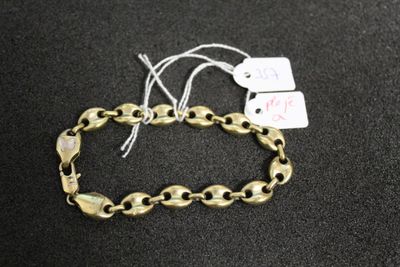 a close up of a bracelet with a tag on it