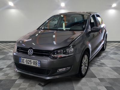 a picture of a grey car parked in a garage