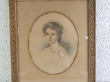 an old picture of a woman in a white dress in a gold frame