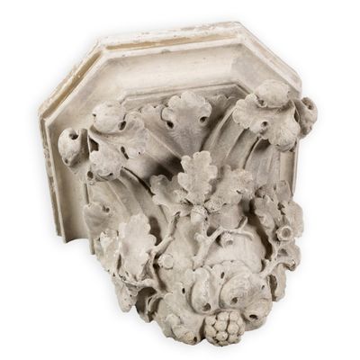 a white sculpture on the wall of a building
