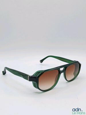 a close up of a pair of sunglasses on a white surface