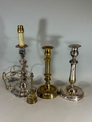 three candles that are sitting next to each other on a table