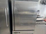 two stainless steel refrigerators in a kitchen next to each other